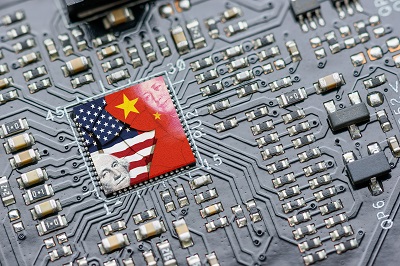 Flag of USA and China on a processor, CPU or GPU microchip on a motherboard. US companies have become the latest collateral damage in US - China tech war