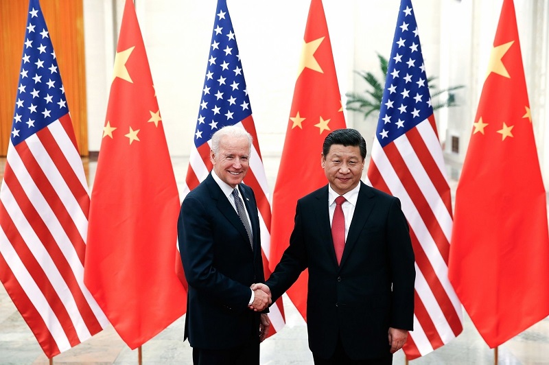 Joe Biden holding hands with Chinese President Xi Jinping