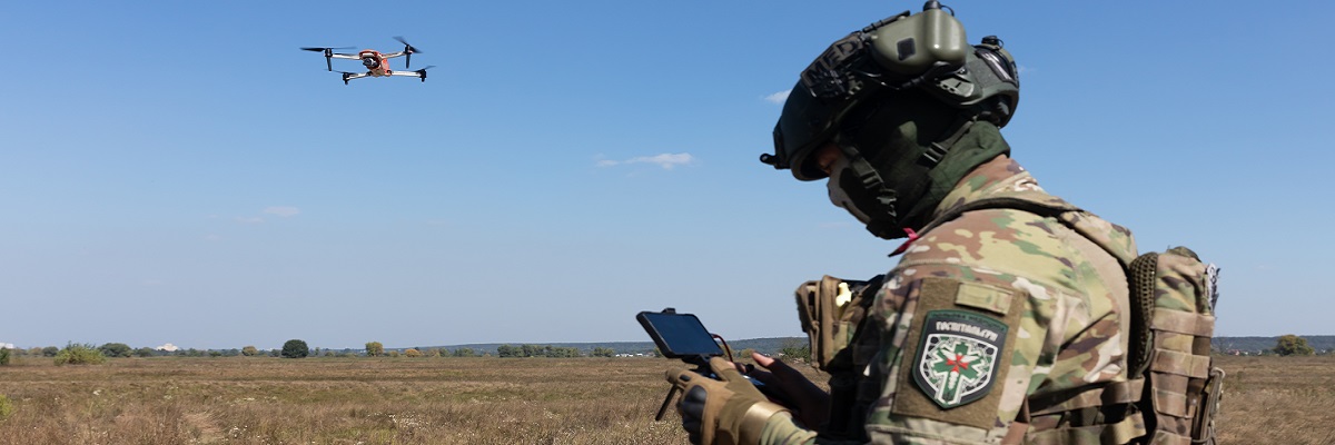 Ukrainian soldier launching a drone for reconnaissance