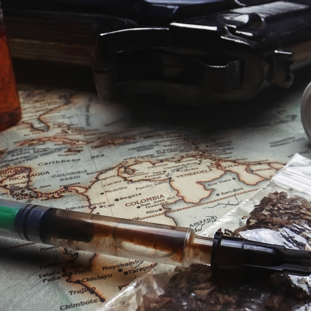 Pistol, synthetic drugs and weed on the map of Colombia.					