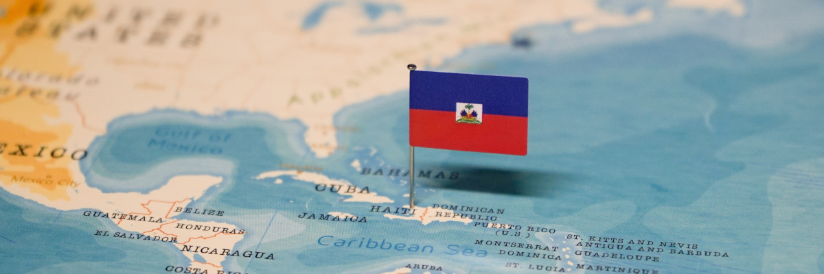 The flag of Haiti on the world map.					
